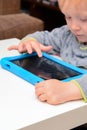 Child using a tablet touch screen device Royalty Free Stock Photo