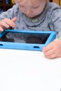 Child using a tablet touch screen device Royalty Free Stock Photo