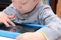 Child using a tablet touch screen device Royalty Free Stock Photo