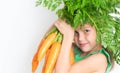 A child with a vegetable