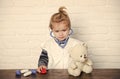 Child veterinarian examine teddy bear with stethoscope