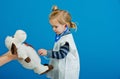 Child veterinarian examine toy animal with stethoscope