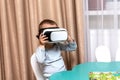 Child with virtual reality goggles dream trip around the world. educational games using modern technology virtual reality glasses Royalty Free Stock Photo