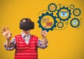 Child with Virtual reality headset touching education icons gears learning graphics drawings