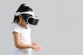 Child with Virtual Reality, VR, Headset Studio Shot Isolated on White Background. Kid Exploring Digital Virtual World with VR Royalty Free Stock Photo