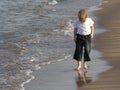 Child walk on beach Royalty Free Stock Photo