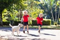 Child walking dog. Kids and puppy. Boy and pet Royalty Free Stock Photo