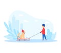 Child walking dog on sled in snowy city park. Young boy in winter clothes with pet enjoying snow. Winter fun and outdoor Royalty Free Stock Photo