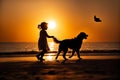 Child walking with a dog. sunset beach background Royalty Free Stock Photo