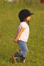 Child walking in the meadow Royalty Free Stock Photo