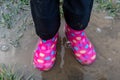 child walking in mud