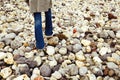 Child walking on the pebbles at the beach Royalty Free Stock Photo