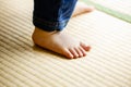 Child walking on tatami in japanese house.