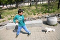 Child walks with dog