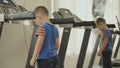 The child walks on the treadmill