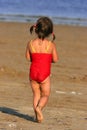 Child Wandering Towards The Sea