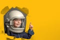 child wants to fly an airplane wearing an airplane helmet
