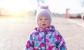 A child in warm clothes on the street. Girl child portrait Royalty Free Stock Photo