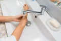 The child washes his hands up to the elbows in the bathroom sink Royalty Free Stock Photo