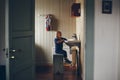 Child washing in a country house sink, tender image of children developing their independence