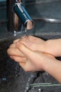 Child washing his hands to prevent illness Royalty Free Stock Photo