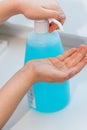 Child washing his hands using hydroalcoholic gel Royalty Free Stock Photo