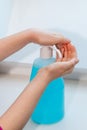 Child washing his hands using hydroalcoholic gel Royalty Free Stock Photo
