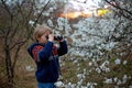 Child, watching amazing sunset with binoculars Royalty Free Stock Photo