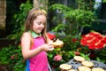 Child watching butterfly at tropical garden Royalty Free Stock Photo