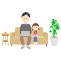 A child watching with his father working on the couch at home