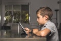 Child watching a tablet at home