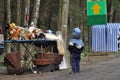 A child watching a toy stall. Wicker baskets, Bialowieza Forest. Object of desire. Children's dreams