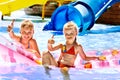 Child on water slide at aquapark. Royalty Free Stock Photo