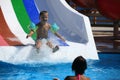 Child on water slide at aquapark