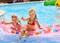 Child on water slide at aquapark. Royalty Free Stock Photo