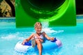 Child on water slide at aquapark Royalty Free Stock Photo