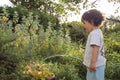 Child watering garden