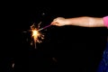 A child waves fireworks