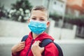 The boy wear a mask before going to school preventing outbreak Infectious