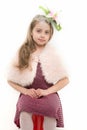 Child wear fur cape and dress