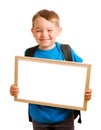 Child wearing backpack and holding blank sign Royalty Free Stock Photo