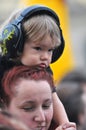 Child wearing ear for kids during a concert