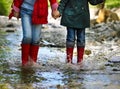 Child wearing rain boots jumping. Close up Royalty Free Stock Photo