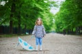 Child wearing rain boots with umbrella on a fall day Royalty Free Stock Photo