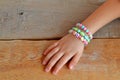 Child wears bracelets on his hand Royalty Free Stock Photo