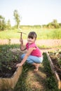 The child is weeding garden,help parents, ecology