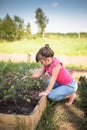 The child is weeding garden,help parents, ecology