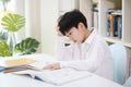 Tired child tired of boring study and a lot of piled up school homework Royalty Free Stock Photo