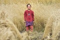 A child who works and gathers grain from the field Royalty Free Stock Photo