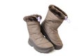 child winter boots, brown colored, isolated on white Royalty Free Stock Photo